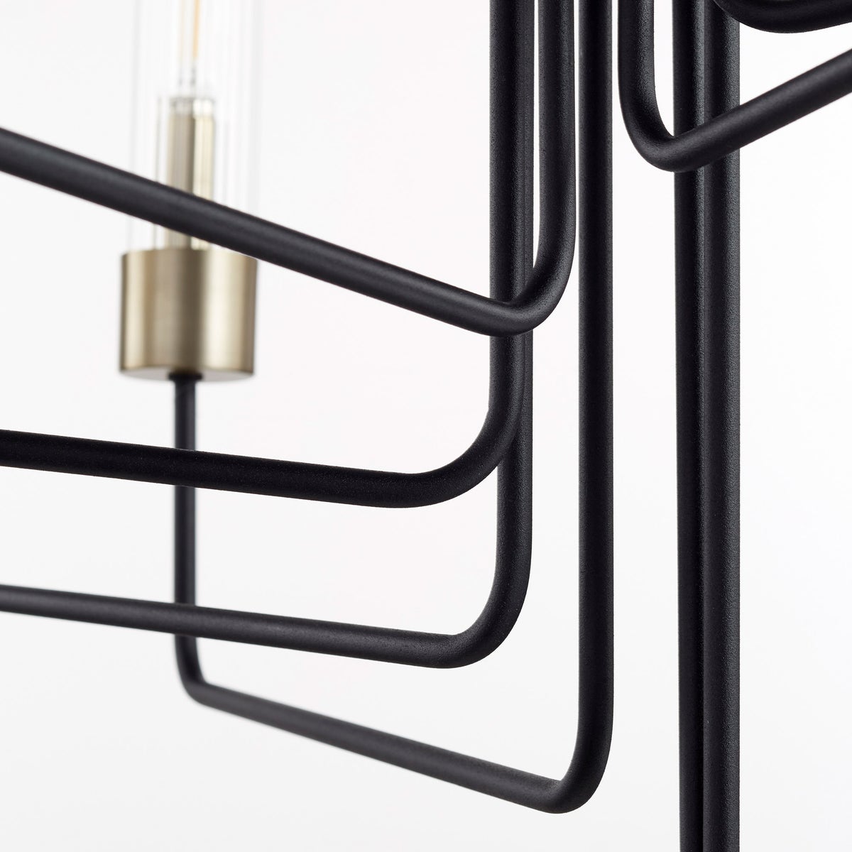 Transitional chandelier with clear glass bulbs and tubes, featuring a linear frame and soft-angular curves. Two-toned aged brass and noir finish. Suitable for indoor and outdoor spaces. Adjustable chain/stem hung suspension system. 34.5"W x 33.5"H. Quorum International.